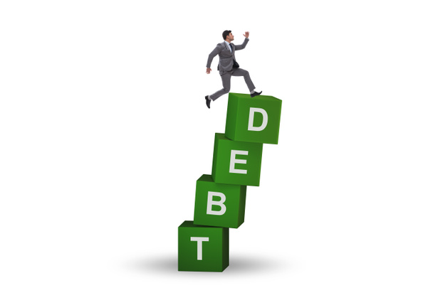 Концепция долга и кредита с бизнесменом на кубиках - Фото, изображение
