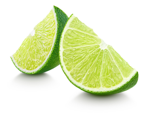 Slices of lime citrus fruit isolated on white - Foto, imagen