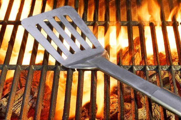 Spatula on the Hot Flaming Grill - Photo, Image