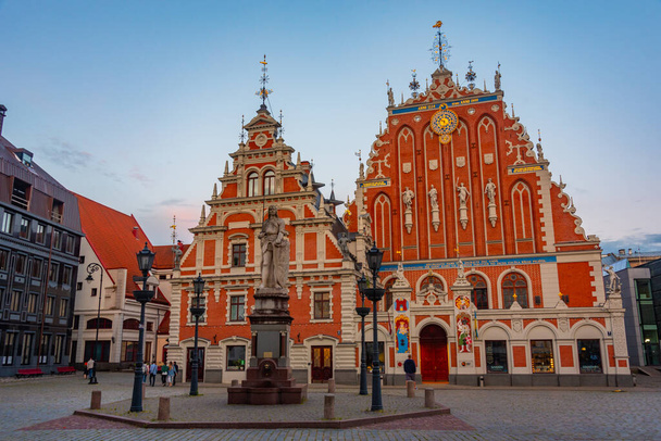 Sunset at Ratslaukums square with the House of Blackheads in old town of Riga in Latvia.. - Photo, image