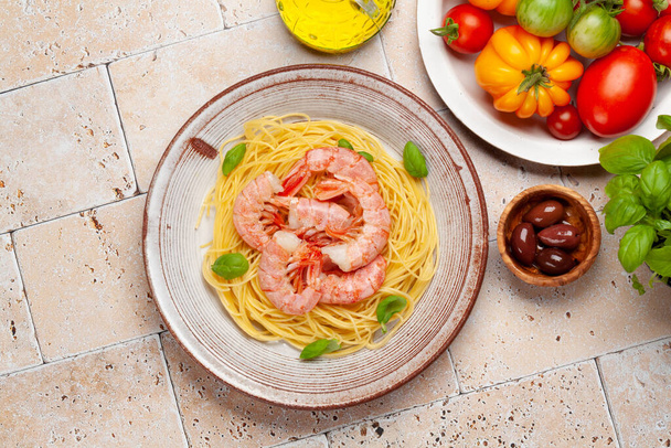 Pasta with shrimps. Italian cuisine. Flat lay with copy space - Photo, Image