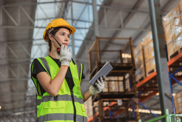 portrait working woman staff worker inventory management supervisor team work operate warehouse products shipping control job. - Φωτογραφία, εικόνα