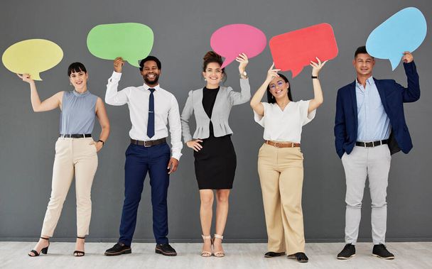 Speech bubble, collaboration and portrait with business people in studio on a gray background for communication. Social media, teamwork and diversity with a group of happy colleagues showing mockup. - Foto, imagen