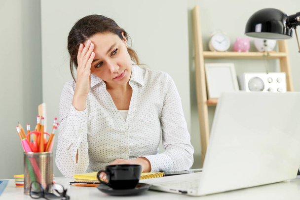 Worried freelancer young woman looking at laptop compute - Φωτογραφία, εικόνα