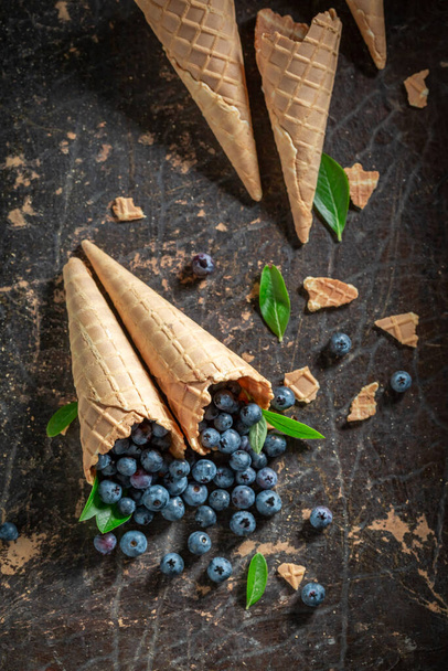 Juicy and tasty berries in waffels as concept of ice cream. Forest fruits and wafers as ice cream concept. - Foto, immagini