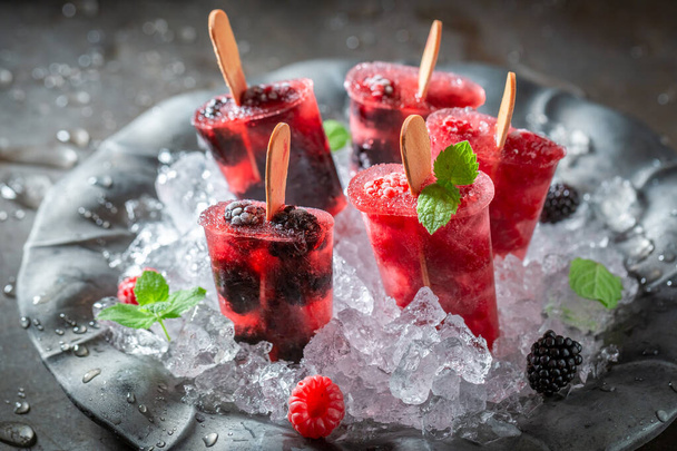Tasty and fresh berry fruits ice cream made with water. Frozen forest fruits as sorbet ice cream. - Foto, Bild