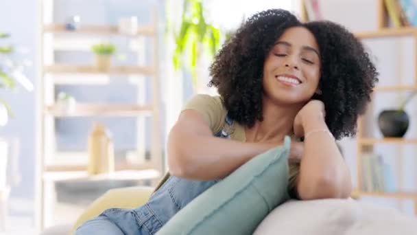 Face, smile and woman relax in living room for easy lifestyle, me time and happiness of calm morning. Happy portrait of young female resting in lounge, apartment and freedom for comfortable self care. - Footage, Video