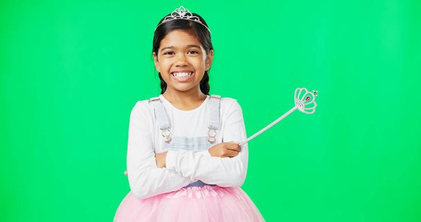 Girl child, princess and face in green screen studio with smile, happiness and playing game for fantasy. Happy young female, royal aesthetic and fairytale portrait for costume party, games or fantasy. - Photo, Image