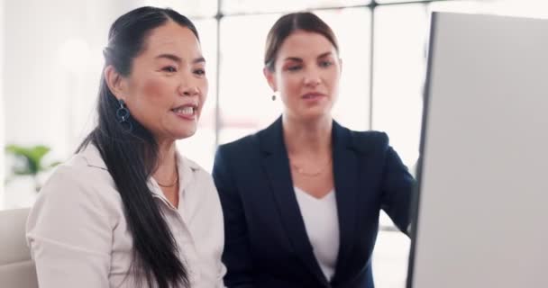 Coaching, computer or human resources with business women in an office, working together for introduction. Collaboration, mentor or training with a corporate woman employee team at work on a desktop. - Footage, Video