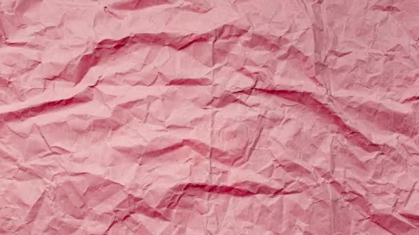 Stop motion photography animation concept. Close-up of crumpled paper of red color. Textured abstract background with copy space. - Footage, Video