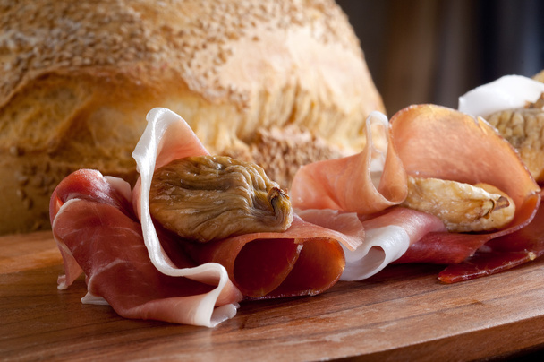 Italian appetizer with parma ham and dried figs - Photo, Image