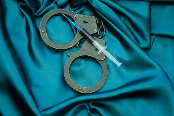 handcuffs and accessories on a black background - Zdjęcie, obraz