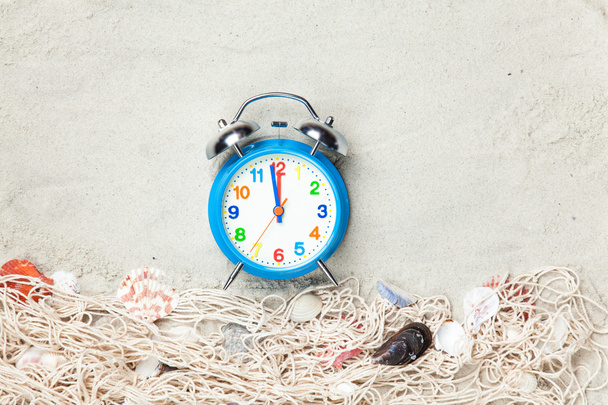 Alarm clock and net with shells  - Photo, Image