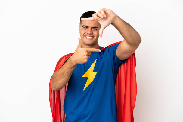 Super Hero over isolated white background focusing face. Framing symbol - Photo, Image