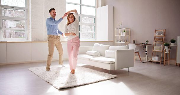 Excited Family Couple Dancing. People Dance At Home - Photo, image