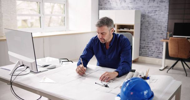 Architect Engineer Drawing Architectural Construction Plan In Office - Foto, immagini