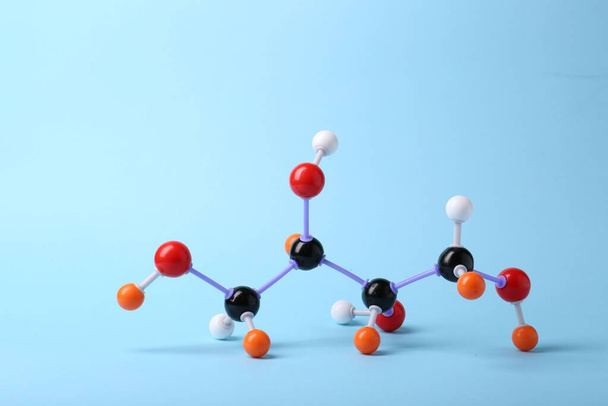Molecule of sugar on light blue background. Chemical model - Foto, immagini