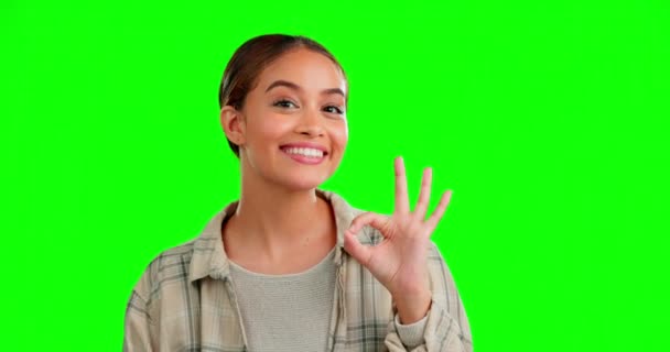 Woman, ok hand sign and green screen with face, smile or excited in studio for happiness by background. Model girl, happy or mockup portrait for emoji, icon or gesture for agreement, approval or vote. - Footage, Video