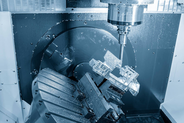 The 5-axis machining center cutting aerospace parts with solid ball end mill tool. The hi-precision automotive manufacturing process by multi-axis CNC milling machine. - Zdjęcie, obraz