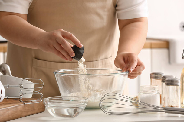 Woman preparing dough for Italian Grissini at table in kitchen, closeup - Photo, Image