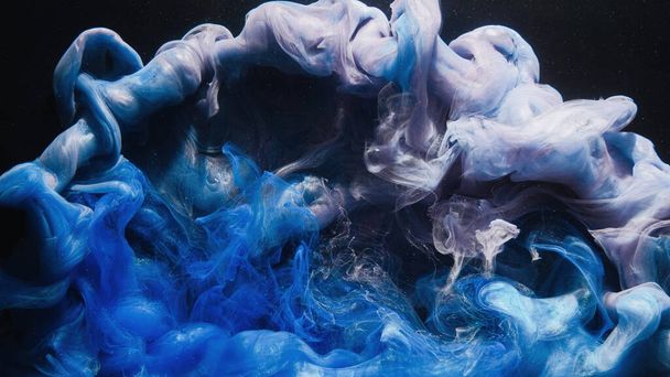 Ink water. Paint drop. Smoke cloud. Blue purple color glitter glowing vapor splash on black abstract art background with free space. - Foto, imagen