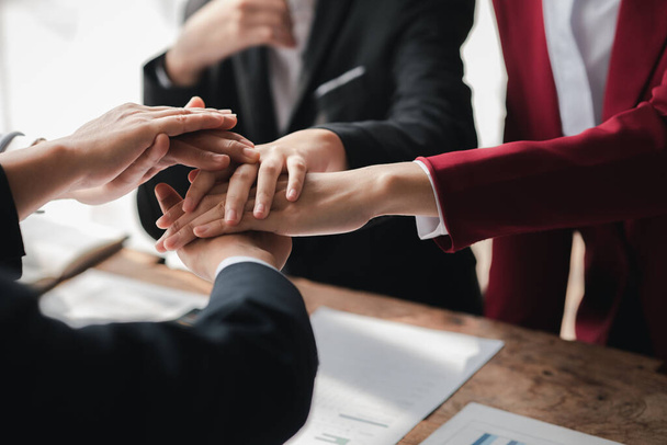 A group of business people joining hands, business meetings, startup company sales team meetings, brainstorming and summary of company performance. Business strategy management concept. - Foto, imagen