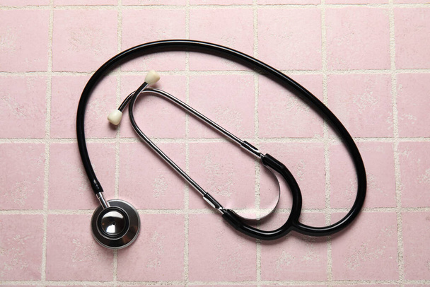 Modern stethoscope on pink background - Photo, image