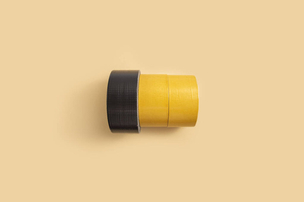 Construction colored tape on a light background. Top view, flat lay. - Zdjęcie, obraz