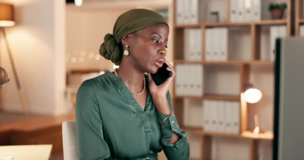 Phone call, night and black woman in international communication, global client or office discussion. African virtual assistant or Nigeria business person talking on smartphone and typing on computer. - Footage, Video