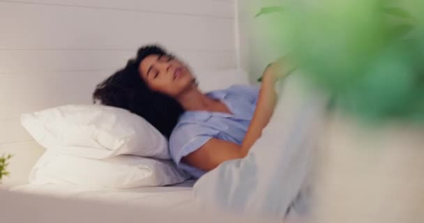 Woman, bed and insomnia or restless for sleep or rest in home bedroom with fatigue or stress. Female person frustrated with sleeping problem, depression or disorder while dreaming or sleepless. - Кадры, видео