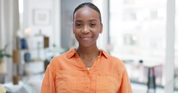 Face of proud black woman in office with business mindset, integrity or goals for work from home opportunity. Portrait of young employee, freelancer or person in her apartment smile for job or career. - Footage, Video