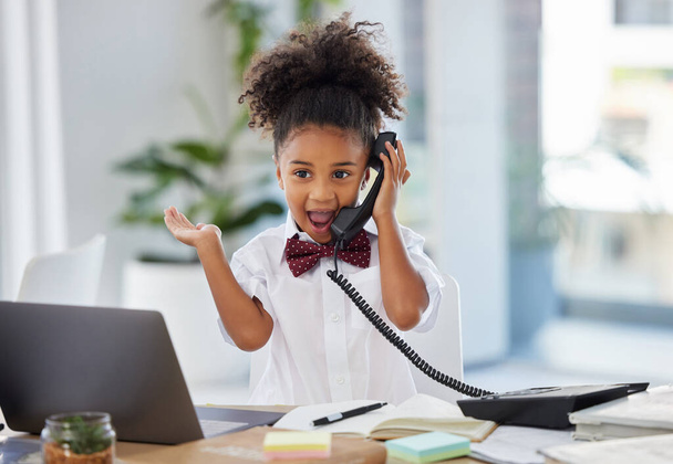 Phone call, telephone and surprise with child in office for communication, news and notification. Excited, business and comic with young girl at desk in workplace for shocked, wow and announcement. - Foto, Imagem
