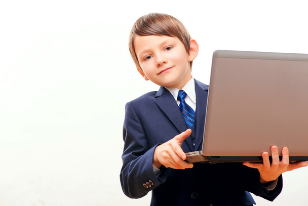 Business child in suit and tie posing with laptop - Foto, immagini
