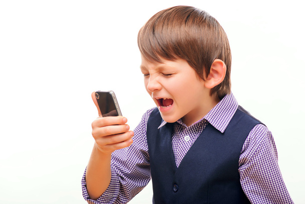 Boy shouting over the mobile phone - Foto, Imagen
