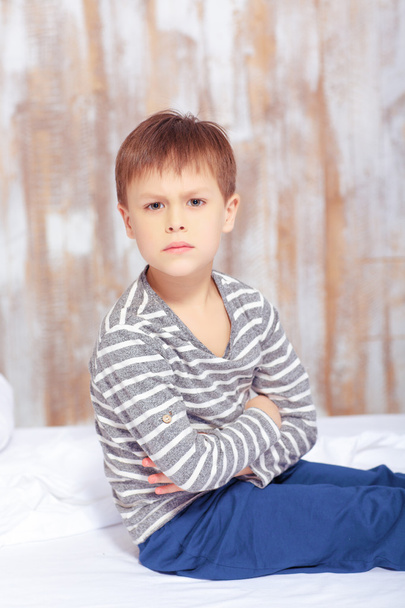 Emotional little boy in bed - Photo, image