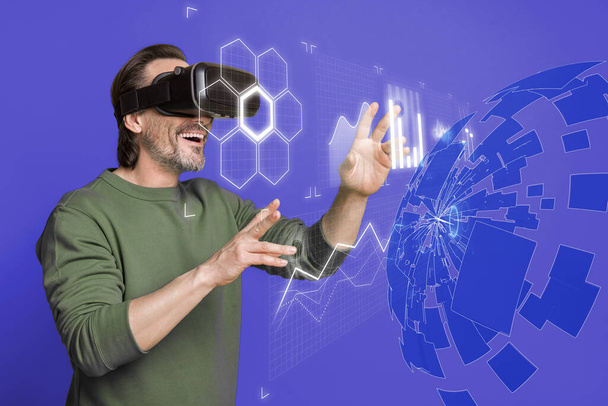 Virtual surreal collage of businessman wearing headset choosing app on futuristic holographic screen. - Foto, Bild