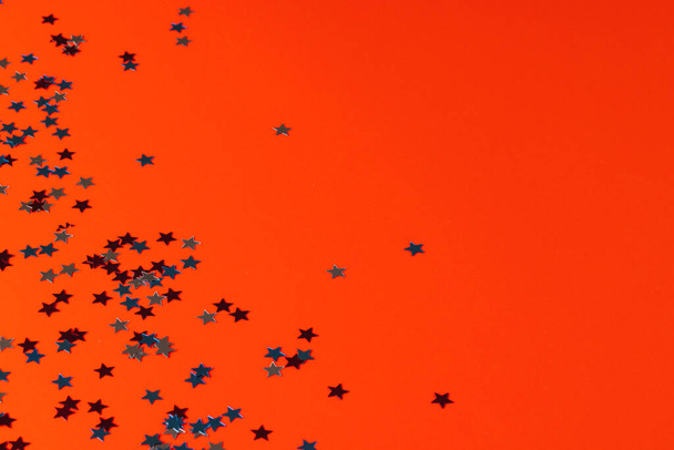 Red, blue and white stars of flag of united states of america with copy space on orange background. American patriotism, independence day and tradition concept. - Photo, image