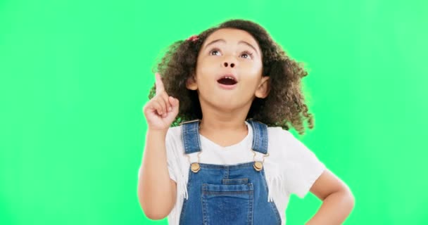 Idea, thinking and child pointing up at mockup space or green screen isolated against a studio background. Portrait, cute and smart, clever and intelligent kid or young person for brand placement. - Footage, Video