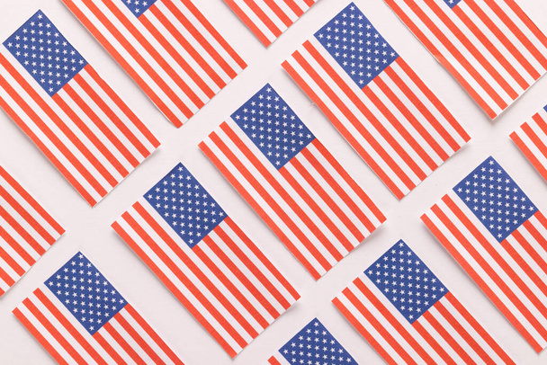High angle view of rows of flags of united states of america on white background. American patriotism, independence day and tradition concept. - Foto, afbeelding