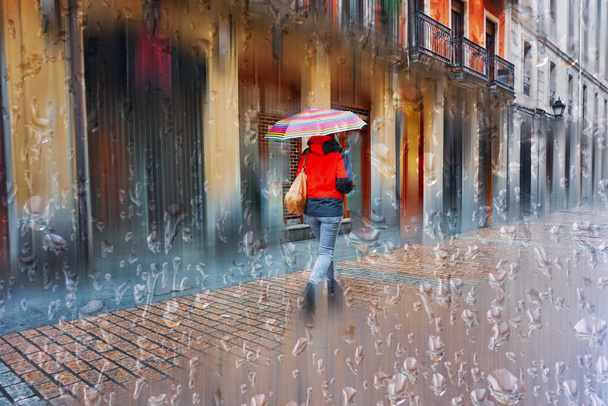 people with an umbrella in rainy days in winter season, bilbao, basque country, spain  - Zdjęcie, obraz