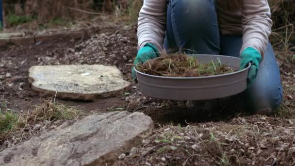 Gardener preparing soil with soil sieve for growing plants medium slow motion shot selective focus - Footage, Video