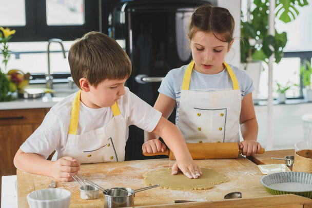 Family cooking together in the modern kitchen  - Photo, Image