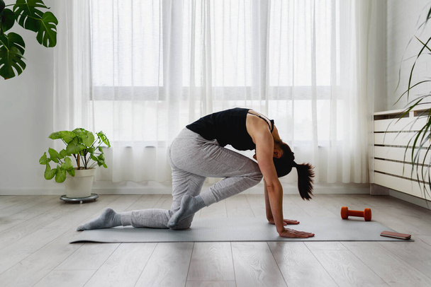 young woman doing yoga exercises  - Фото, изображение