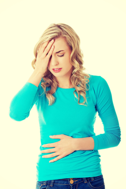 Sick woman holding her stomach - Foto, Imagem