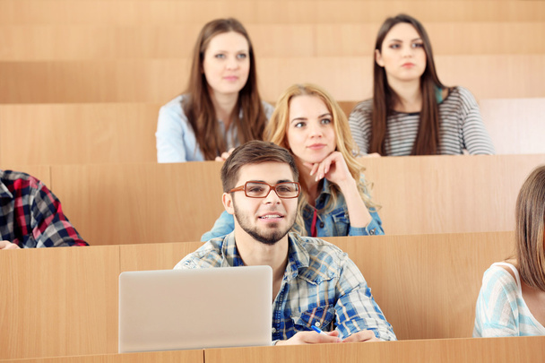 Group of students sitting in classroom - Photo, image