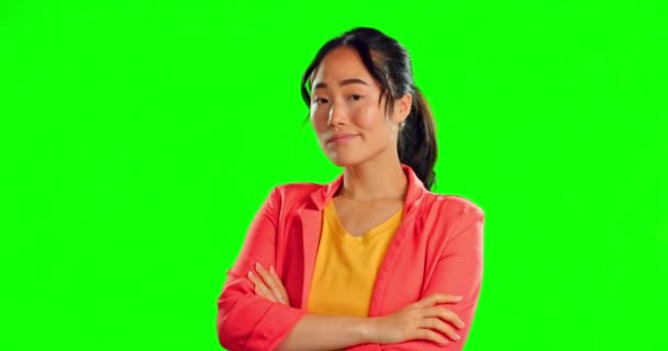 Annoyed, disappointed and arms crossed with Asian woman in studio for angry, conflict and suspicious. Mad, negative and attitude with female on green screen background for upset, frustrated or ignore. - Footage, Video