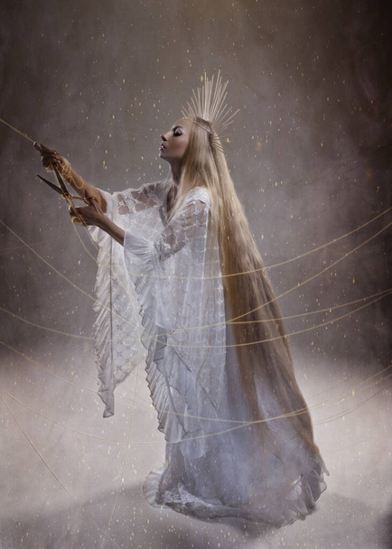 Goddess of fate moira with scissors is preparing to cut the thread of life. Ancient mythology - Photo, Image