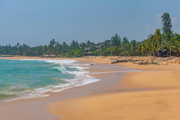 Sunny day at Marakolliya beach at Sri Lanka. - Photo, Image