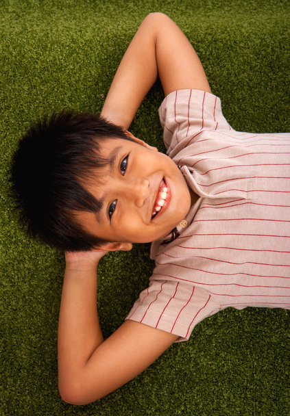 Asian Boy Relaxing On The Lawn - Photo, Image