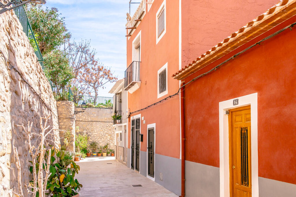View to beautiful Villajoyosa street with multi-colored houses. Villajoyosa - coastal town in Alicante Province, Valencian Community, Spain, by Mediterranean Sea. - Foto, Imagen